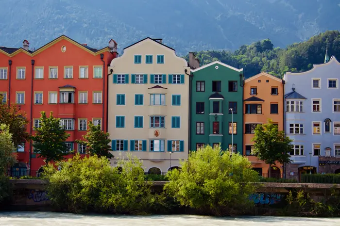 Colourful traditional houses along the river in Innsbruck.
